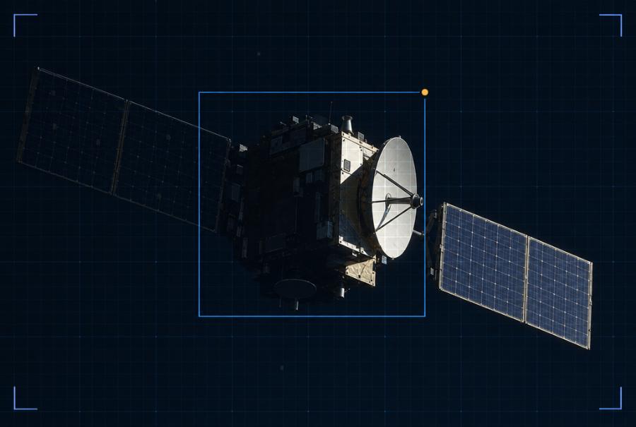 Illustration: a satellite half in shadow seen through a spacecraft camera with a detection box